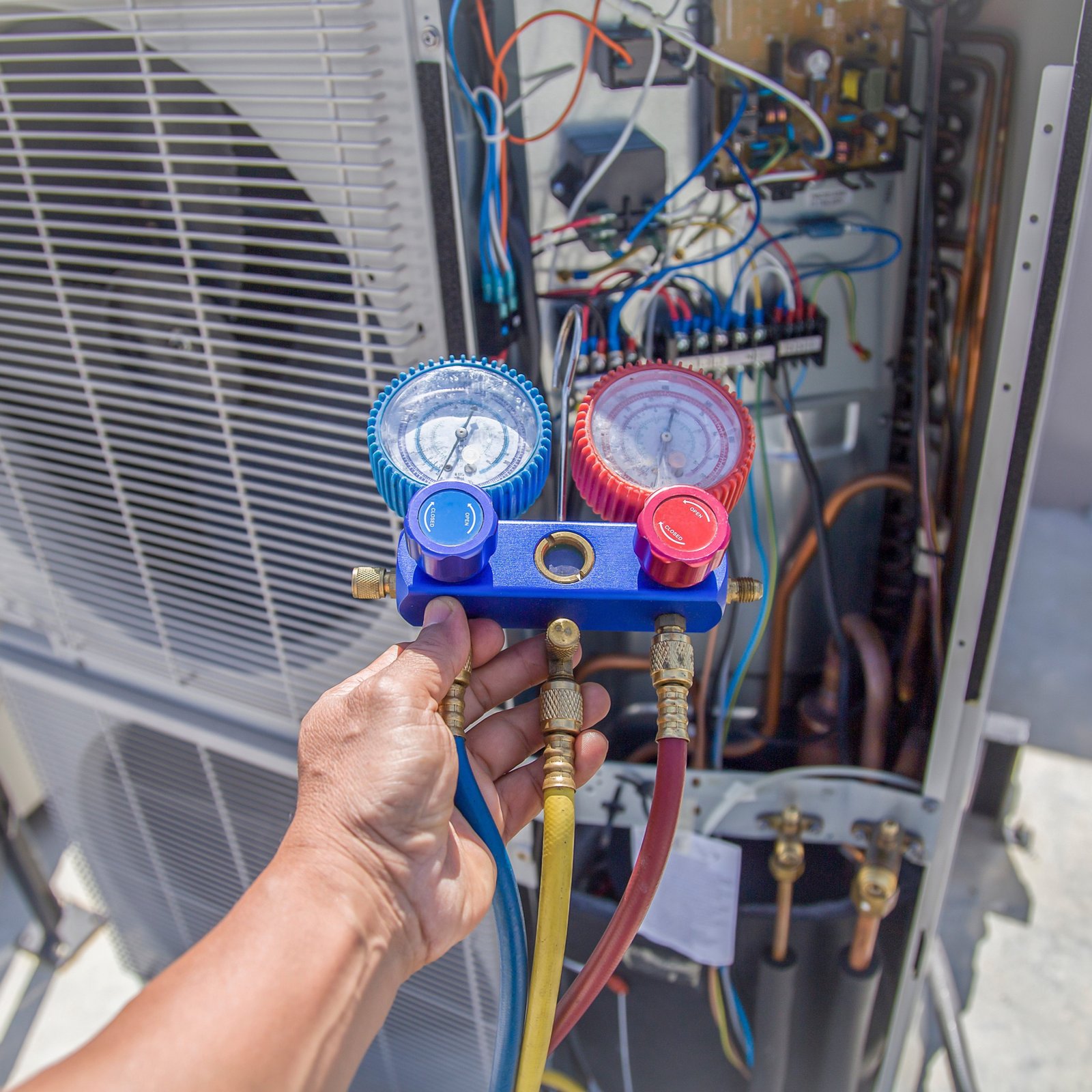 AC TO THE MAX, INC HVAC Technician performing repair work in Phoenix.